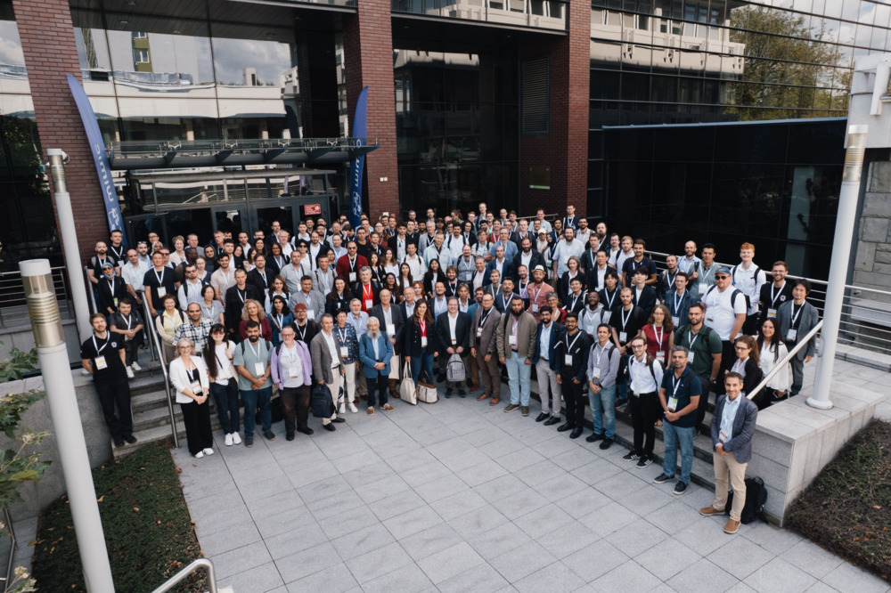 Mohamed among a crowd of researchers on a group photo in DSD2026